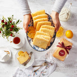 A freshly homemade lemon loaf being served.